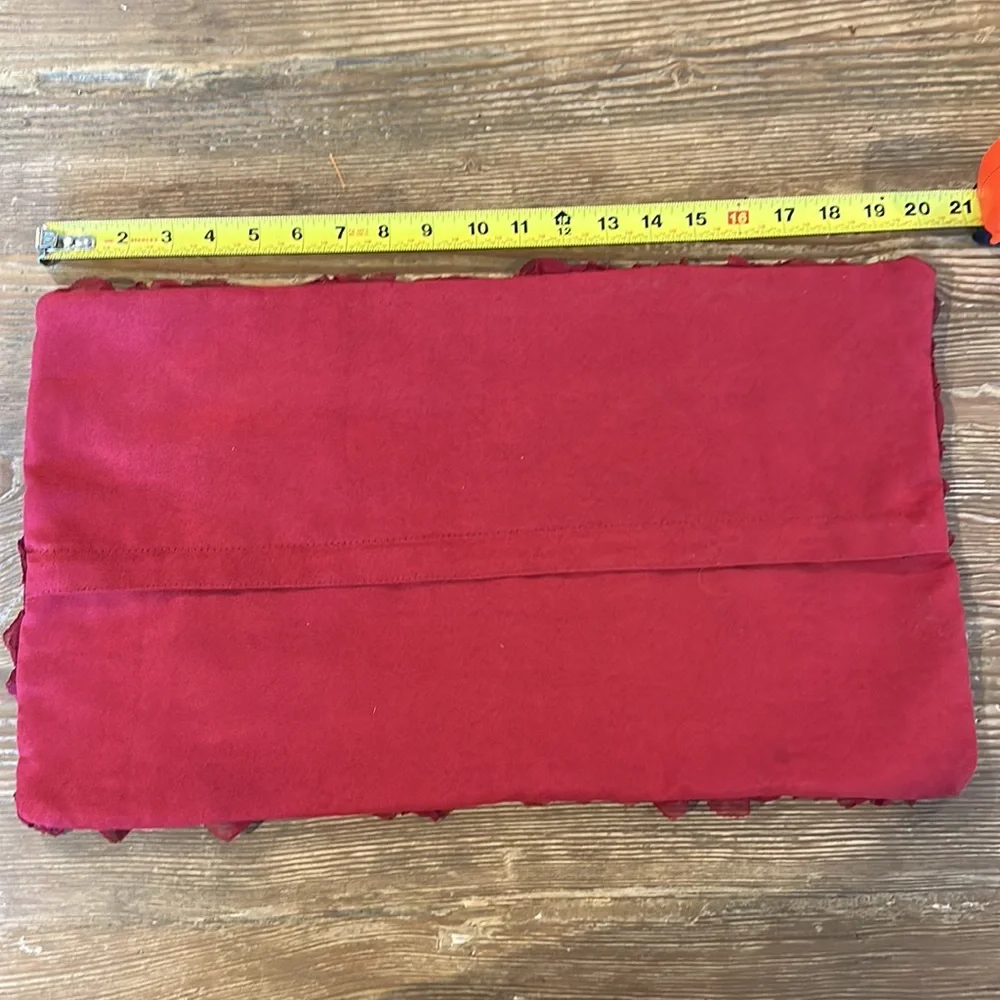 Red pillow case with embellishments of rose flowers zipper